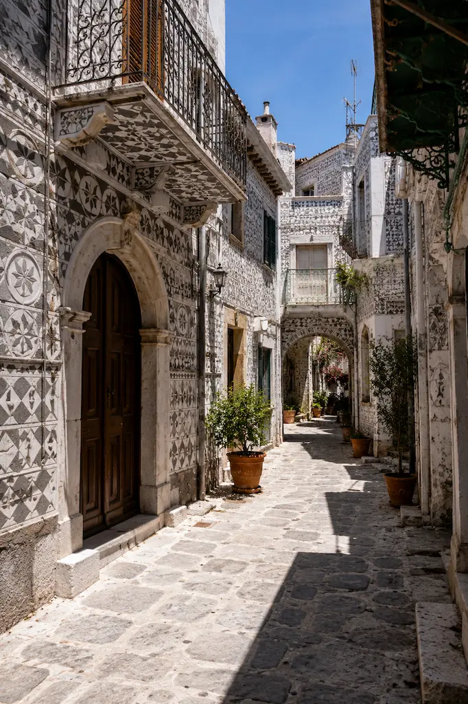 Black-and-white xysta-decorated buildings inspired by the traditional architecture of Pyrgi on Chios, Greece