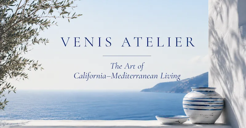 White Mediterranean terrace overlooking the sea with blue ceramic pottery and olive branches, representing California–Mediterranean coastal living.