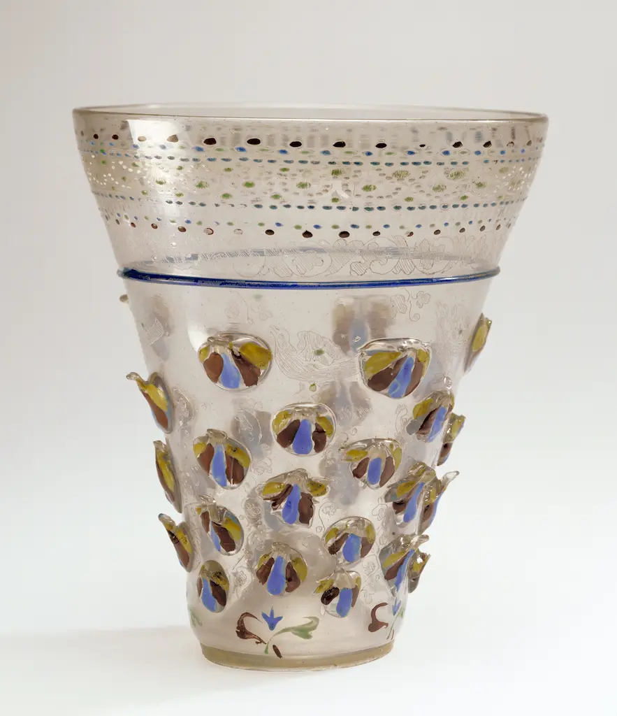 Historic footed glass beaker with distinctive applied prunts from the collection of the J. Paul Getty Museum.